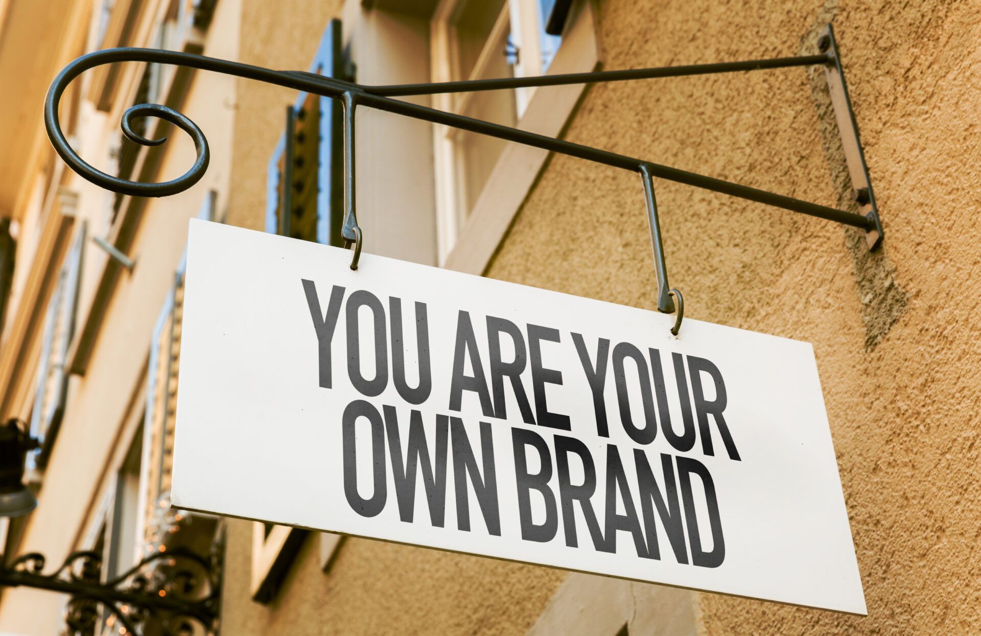 Hanging sign with wording "You are your own brand".